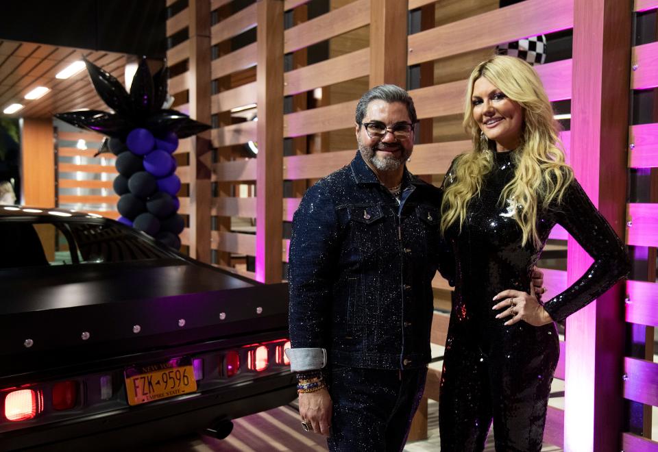 Designer Wilfredo Emanuel poses on the red carpet with Courtney Hansen at the premiere party for Hansen's new show 'Ride of Your Life' on Wednesday, Sept. 7, 2022. Emanuel was designer and producer  for a jazzy makeover of a 1987 Buick Grand National.