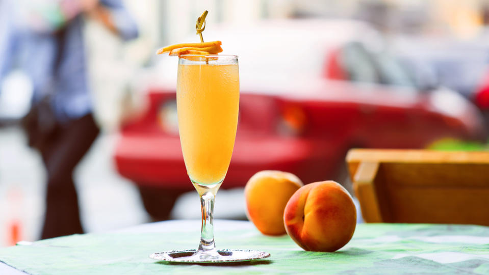 Bellini cocktail on the table at bar's terrace outdoor in the downtown