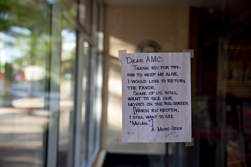 A hand-written letter by a Movie-Goer hangs on the window of an AMC Entertainment Holdings Inc. movie theater in Arlington, Virginia, U.S., on Monday, June 8, 2020. | Andrew Harrer—Bloomberg via Getty Images.