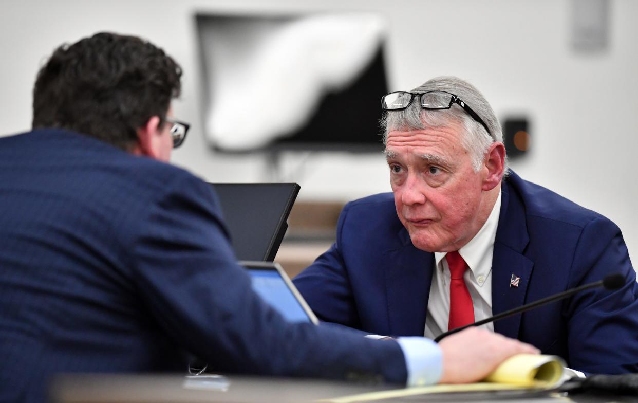 Johns Hopkins All Children's Hospital attorneys David Hughes, left, and C. Howard Hunter, right, confer during testimony in court Tuesday, Oct. 3, 2023 at the South County Courthouse in Venice, Florida. The Kowalski family is suing Johns Hopkins All Children's Hospital for false imprisonment, negligent infliction of emotional distress, medical negligence, battery, and other claims more than a year after the family matriarch, Beata Kowalski, took her life following allegations she was abusing her daughter, Maya Kowalski. Pool photo/Mike Lang/Sarasota Herald-Tribune