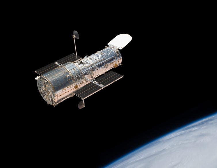 <span class="caption">The Hubble Space Telescope in orbit above the Earth.</span> <span class="attribution"><a class="link " href="https://www.shutterstock.com/image-photo/hubble-space-telescope-orbit-above-earth-194177834?src=uCYUdDqorYfTfdP13WRVDQ-1-0" rel="nofollow noopener" target="_blank" data-ylk="slk:MarcelClemens/Shutterstock;elm:context_link;itc:0;sec:content-canvas">MarcelClemens/Shutterstock</a></span>