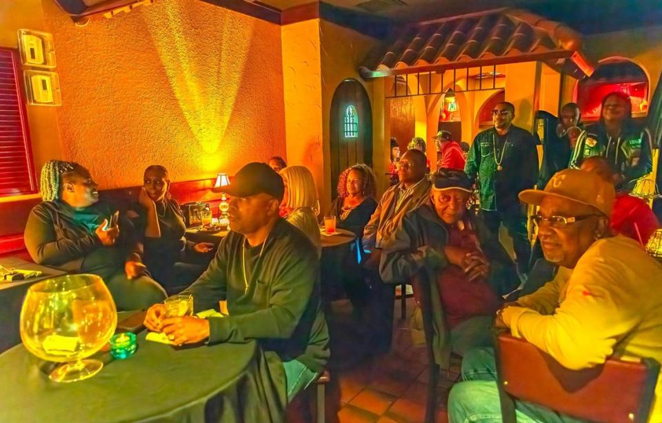 A Friday-night crowd listens to live music in the intimate lounge at the Gates Bar-B-Q at 12th Street and Brooklyn Avenue.