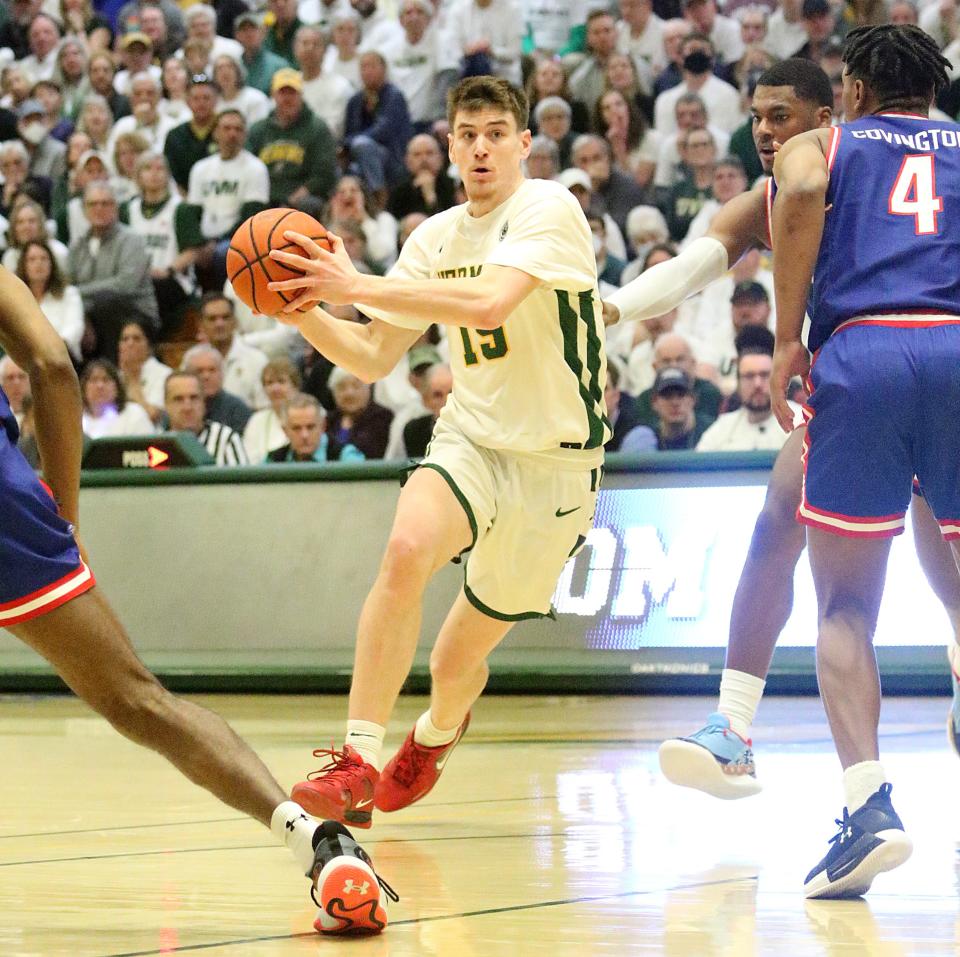 Vermont's Finn Sullivan gets into the lane during the Catamounts 72-59 win over UMass Lowell in the America East championship game on Saturday afternoon at Patrick Gym.