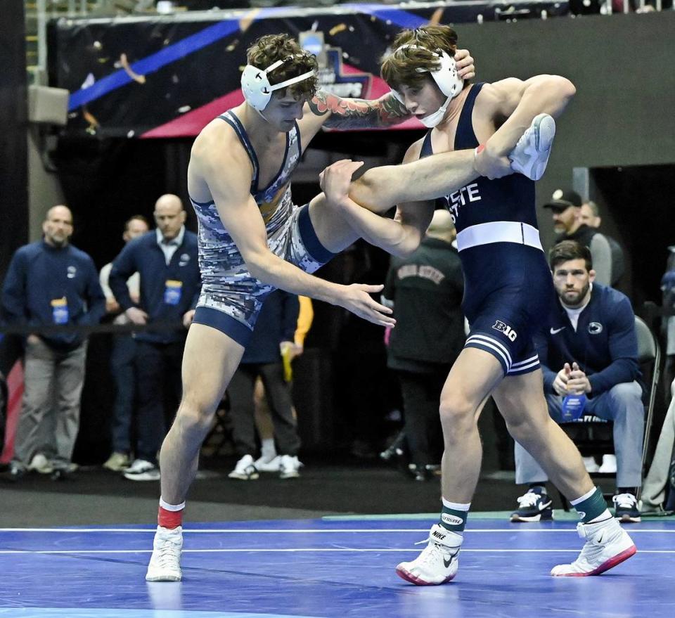 Penn State’s Tyler Kasak attempts to finish off a takedown of West Virginia’s Ty Watters in their 149 pound consolation finals match of the NCAA Championships on Saturday, March 23, 2024 at the T-Mobile Center in Kansas City, Mo. Kasak edged Watters, 3-2, to finish third.