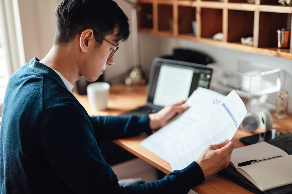 Young business man making financial plan while working from home