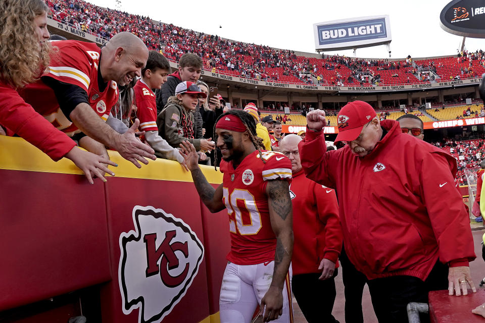 Kansas City Chiefs safety Justin Reid (20) and head coach Andy Reid celebrate with fans after an NFL football game against the Denver Broncos Sunday, Jan. 1, 2023, in Kansas City, Mo. (AP Photo/Charlie Riedel)