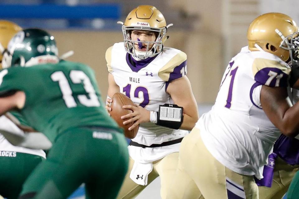 Male’s Nic Schutte (12) runs the ball against Trinity during last year’s Class 6A state championship game, which Trinity won 28-0.