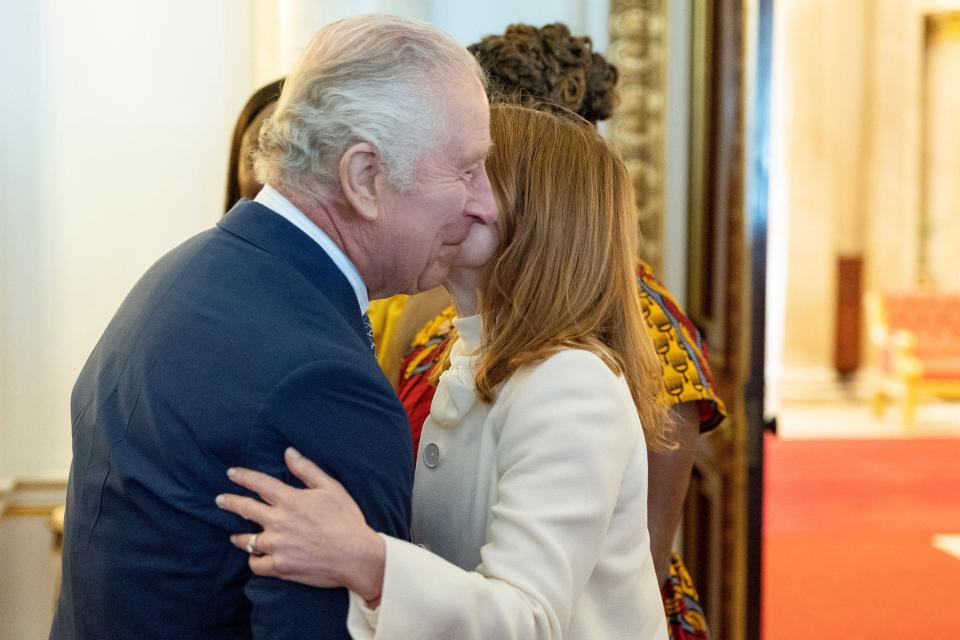 Britain's King Charles III (L) meets with British singer Geri Halliwell Horner (R) during a ceremony for the Trust Award 2023 winners and celebrity ambassadors at Buckingham Palace, in London, on May 17, 2023. (Photo by Geoff Pugh / POOL / AFP) (Photo by GEOFF PUGH/POOL/AFP via Getty Images)