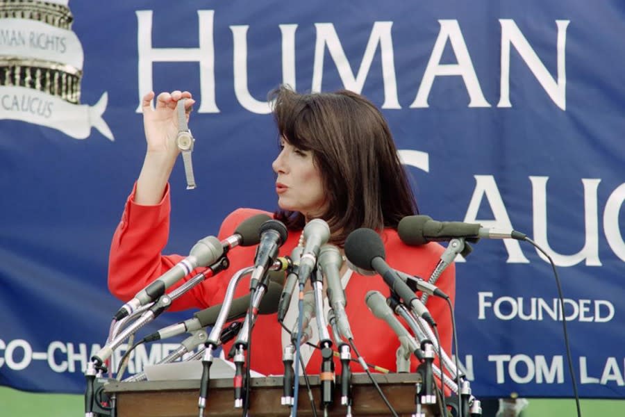 Nancy Pelosi holds a watch on June 4, 1991, reportedly smuggled out of China. Pelosi said the watches were given to soldiers who helped crush the Tiananmen Square protesters. (Photo by Chris Assaf / AFP via Getty Images)