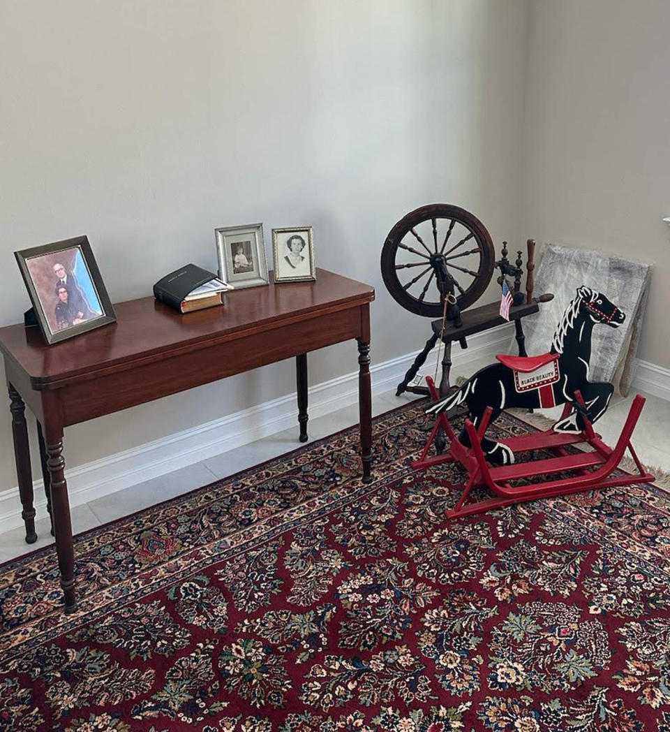 spinning wheel in living area with other old furniture  (Courtesy Emily Grosvenor)