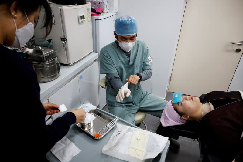 Shin Sang-ho, Director of Krismas Plastic Surgery, prepares to conduct Botox injection, amid the coronavirus disease (COVID-19) pandemic in Seoul