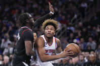 New York Knicks guard Miles McBride, right, drives against Los Angeles Clippers guard Reggie Jackson in the first half of an NBA basketball game, Saturday, Feb. 4, 2023, at Madison Square Garden in New York. (AP Photo/Mary Altaffer)