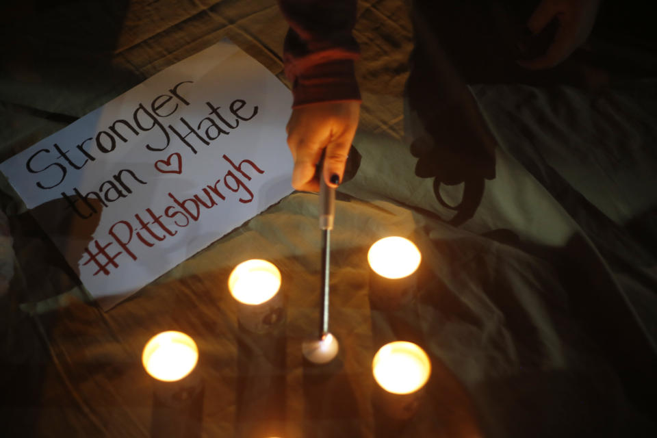 People in Tel Aviv, Israel, light candles Sunday to honor the victims of a deadly shooting at a Pittsburgh synagogue. (Photo: Ariel Schalit/AP)