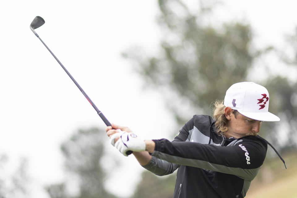 Captain Cameron Smith of Ripper GC hits his shot on the driving range during the second round of LIV Golf Hong Kong at the Hong Kong Golf Club in Hong Kong Saturday, March 9, 2024. (Jon Ferrey/LIV Golf via AP)