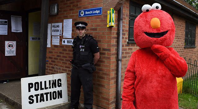 A man waits outside a polling station dressed as Elmo in Berkshire. Source: AAP
