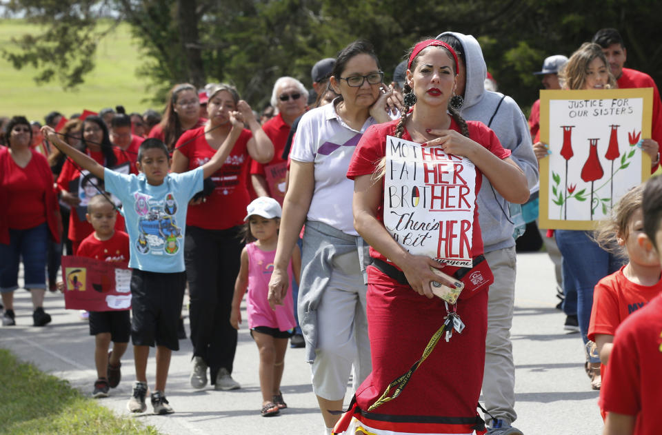 FILE - In this Friday, June 14, 2019, file photo, Miranda Muehl, of Mustang, Okla., marches during a march to call for justice for missing and murdered indigenous women at the Cheyenne and Arapaho Tribes of Oklahoma in Concho, Okla. U.S. Senate staffers say officials missed a second deadline on July 8 to offer input on bills on Native American safety, and only one department has since provided “partial comment.” (AP Photo/Sue Ogrocki, File)