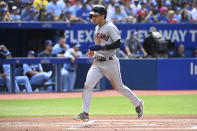 Cleveland Guardians' Steven Kwan scores on a single by Andres Gimenez first-inning baseball game action against the Toronto Blue Jays in Toronto, Saturday, Aug. 13, 2022. (Jon Blacker/The Canadian Press via AP)