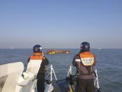 This photo provided by South Korea's Mokpo coast guard shows a capsized boat in waters off the country's southwestern coast, South Korea, Sunday, Feb. 5, 2023. South Korean coast guard vessels and aircraft were searching on Sunday in waters off the country's southwestern coast for nine fishermen who disappeared after their boat capsized. (South Korea's Mokpo coast guard via AP)