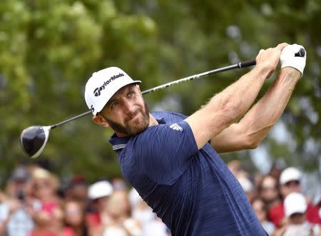 Jul 29, 2018; Oakville, Ontario, CAN; Dustin Johnson hits his tee shot on the first hole during the final round of the RBC Canadian Open golf tournament at Glen Abbey Golf Club. Mandatory Credit: Eric Bolte-USA TODAY Sports