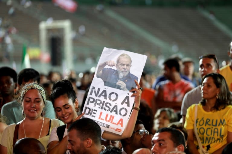 A woman holds a sign reading "No to Lula's imprisonment," referring to Brazilian former President Luiz Inacio Lula Da Silva, during the World Democracy Conference in Salvador, state of Bahia on March 15, 2018