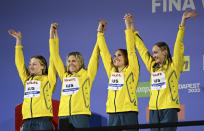 Silver medalist team of Australia celebrate after the Women 4x200m Freestyle Relay final at the 19th FINA World Championships in Budapest, Hungary, Wednesday, June 22, 2022. (AP Photo/Anna Szilagyi)