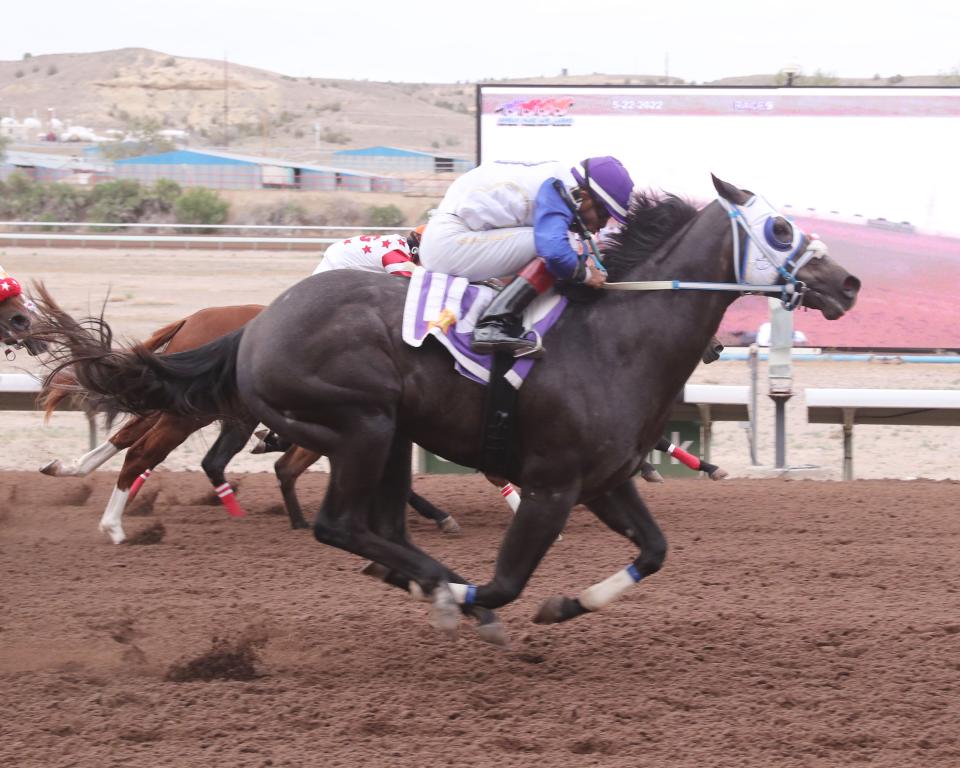 Major Game, with jockey Sergio Becerra, Jr. aboard, crosses the wire ahead of his rivals in the $120,000-added New Mexico Breeders Futurity, Sunday, May 22, 2022 at SunRay Park and Casino.