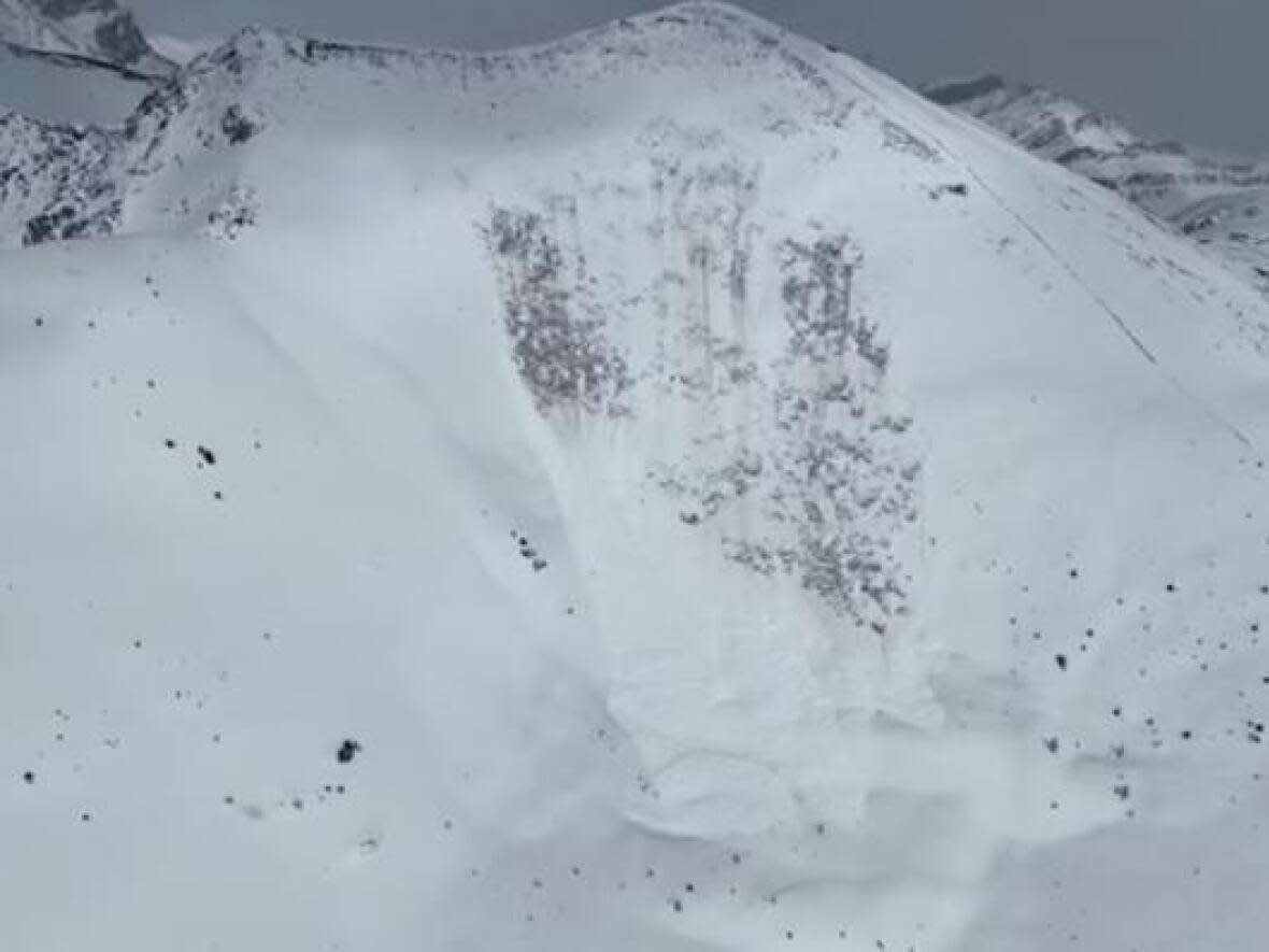 An image shows the aftermath of an avalanche Saturday, April 22, 2023, in Lake Louise Ski Resort's West Bowl area.  (Parks Canada - image credit)