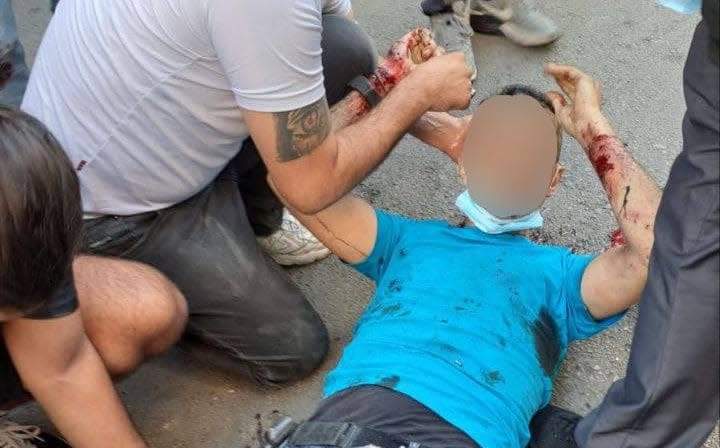 A Lebanese man lies injured on the floor after his pager exploded