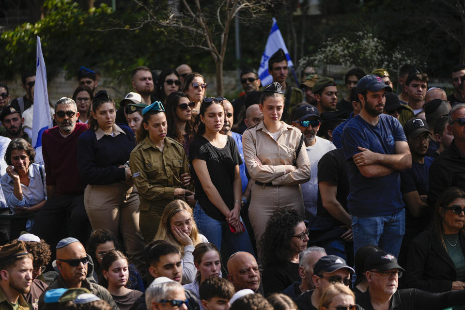 Israelis mourn in grief during the funeral of Sergeant Oz Daniel in Kfar Saba, Israel, Monday, Feb. 26, 2024. Daniel, 19, believed to have been among those killed in the initial Oct. 7 Hamas attack, was declared dead by the military, with his remains still in Gaza. (AP Photo/Ohad Zwigenberg)