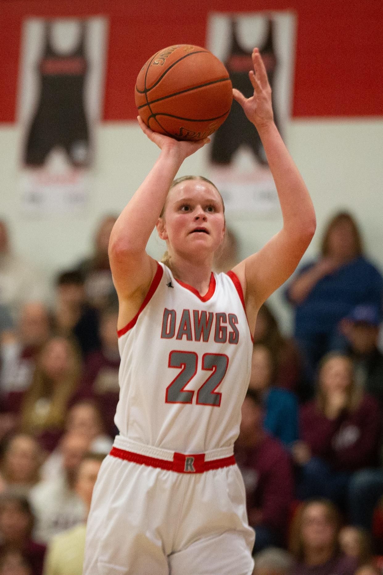 Rossville freshman Nora Burdiek (22) shoots for three against Silver Lake in the first half of the War on 24 game Friday, February 9, 2024, inside Rossville High School.