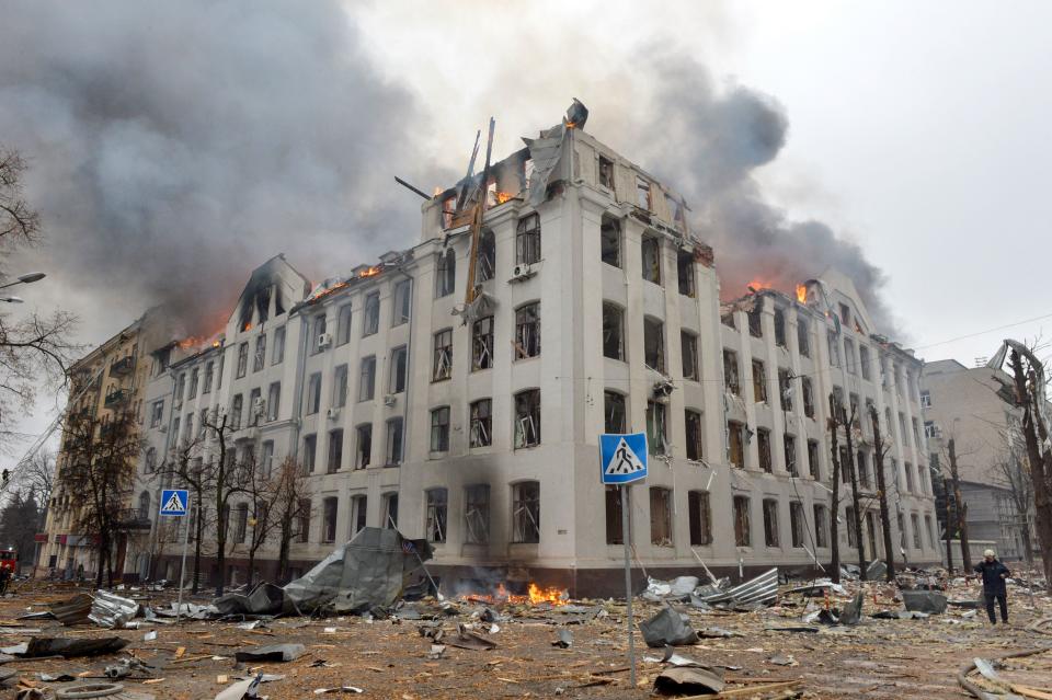 Firefighters work to contain a fire at the Economy Department building of Karazin Kharkiv National University, allegedly hit during recent shelling by Russia, on March 2, 2022. (Photo by Sergey BOBOK / AFP) (Photo by SERGEY BOBOK/AFP via Getty Images)