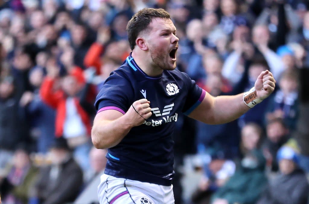 Scotland’s Ewan Ashman celebrates his debut try (Steve Welsh/PA)