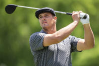 Bryson DeChambeau watches his tee shot on the third hole during the first round of the Wells Fargo Championship golf tournament at Quail Hollow Club on Thursday, May 6, 2021, in Charlotte, N.C. (AP Photo/Jacob Kupferman)