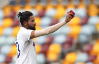 India's Mohammed Siraj gestures with the ball as he leaves the field after taking five wickets during play on day four of the fourth cricket test between India and Australia at the Gabba, Brisbane, Australia, Monday, Jan. 18, 2021. (AP Photo/Tertius Pickard)