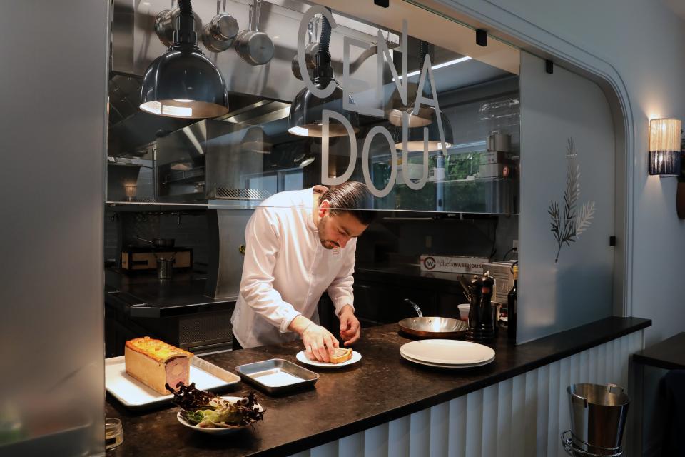 Executive chef and owner Andrea Calstier plates a dish at Cenadou, a new French bistro in North Salem, May 30, 2023.