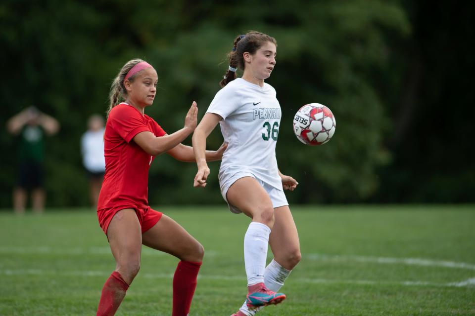 Neshaminy midfielder Abby Collins and Pennridge midfielder Liv Grenda battle for the ball at Neshaminy High School on Tuesday, Sept. 20, 2022. The Skins defeated the Rams at home 2-1.