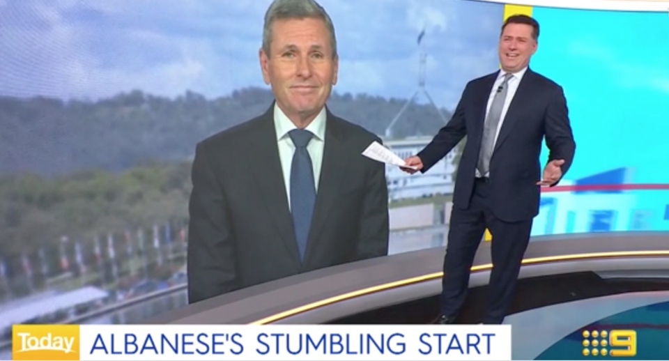 Karl Stefanovic laughing with Chris Uhlmann on screen in the background