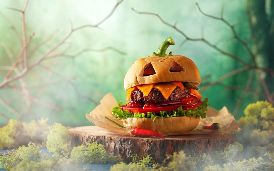 <p>Take our classic burger recipe and arrange the toppings and bun to look like a jack-o-lantern. Simply cut "eyes" into the bread and top with a pepper stem.</p><p>Get the <strong><a href="https://www.womansday.com/food-recipes/food-drinks/recipes/a11186/best-burger-recipe-122556/" rel="nofollow noopener" target="_blank" data-ylk="slk:Best Burger recipe;elm:context_link;itc:0;sec:content-canvas" class="link ">Best Burger recipe</a></strong>.</p>