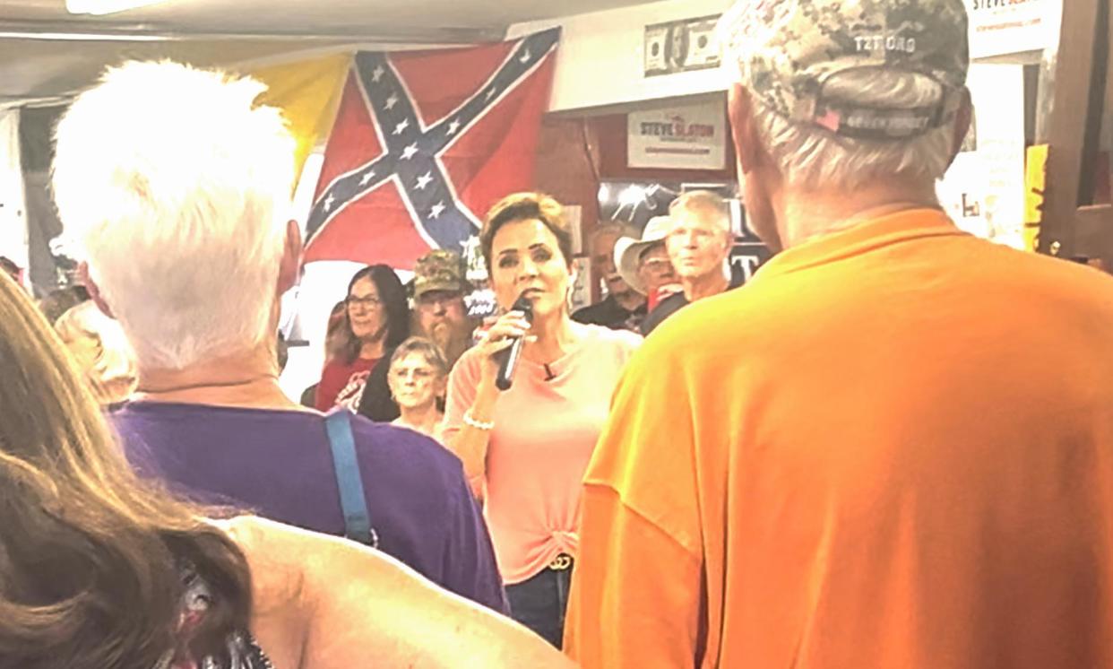 <span>Kari Lake speaks in front of a confederate flag at The Trumped Store in Show Low, Arizona last week.</span><span>Photograph: Obtained by The Guardian</span>