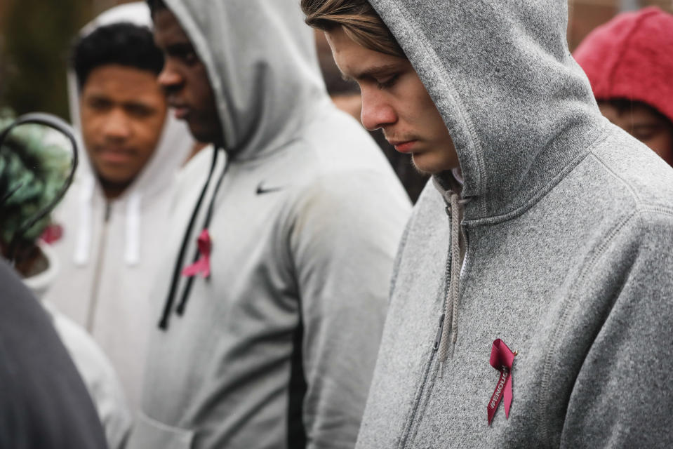 <p>Students wear #ENOUGH pins as they gather on their soccer field during a 17-minute walkout protest at the Stivers School for the Arts, Wednesday, March 14, 2018, in Dayton, Ohio. Students across the country planned to participate in walkouts Wednesday to protest gun violence, one month after the deadly shooting inside a high school in Parkland, Fla. (Photo: John Minchillo/AP) </p>