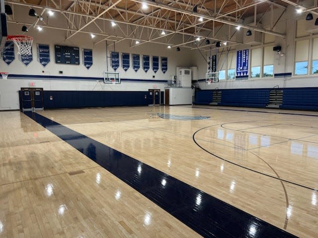 "The Shoebox," Monmouth-Roseville High School's gym, has a new sound system, paint job, and new navy blue seats.