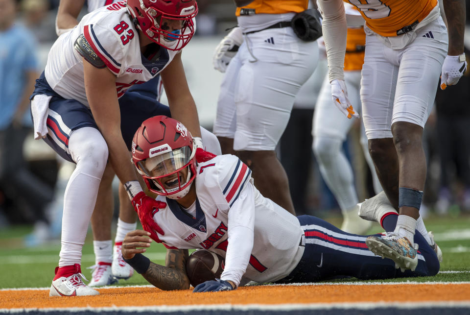 Liberty quarterback Kaidon Salter (7) reacts after falling short by a yard of scoring a touchdown against UTEP during the first half of an NCAA college football game on Saturday, Nov. 25, 2023, in El Paso, Texas. (AP Photo/Andres Leighton)