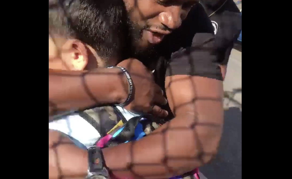 Philadelphia fathers comforted a scared elementary student with hugs and encouragement. (Screenshot: Twitter/Tori_Philly4) 