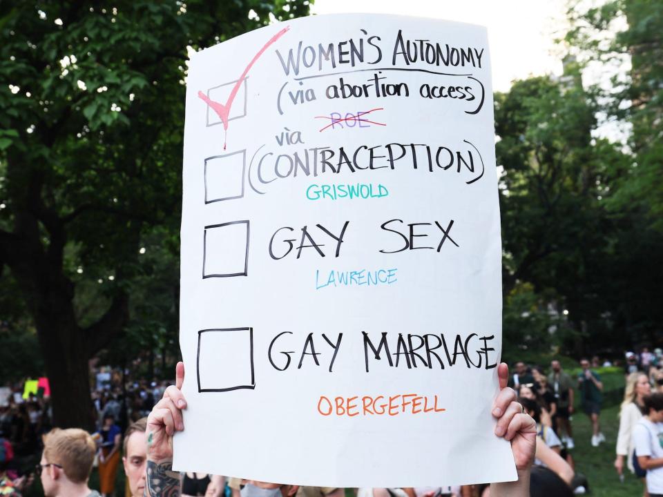 A person holds up a sign as they join people to protest the Supreme Courts 6-3 decision in the Dobbs v. Jackson Women’s Health Organization at Washington Square Park on June 24, 2022 in New York City.