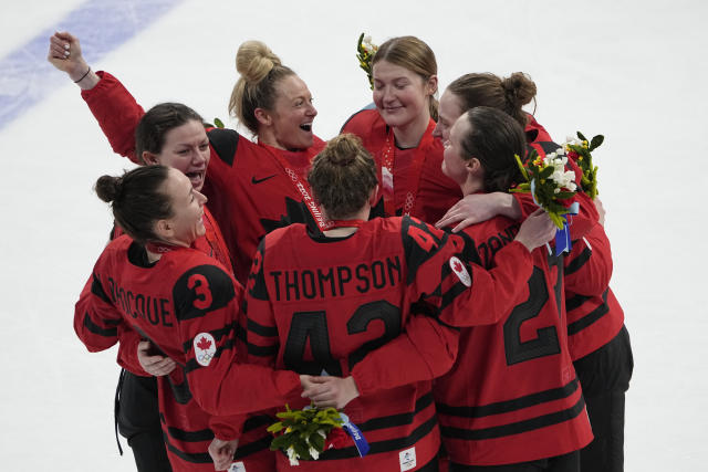 Canada celebrates their gold medal after defeating the United States during the women's gold medal hockey game at the 2022 Winter Olympics, Thursday, Feb. 17, 2022, in Beijing. (AP Photo/Jae C. Hong)