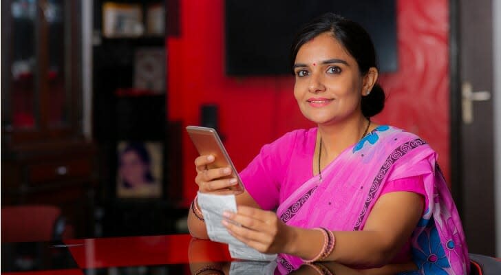 Indian woman checking her dividend payout