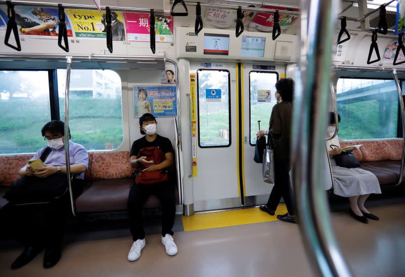 So Sato, a deaf and transgender pole vaulter, rides a train in Tokyo, Japan