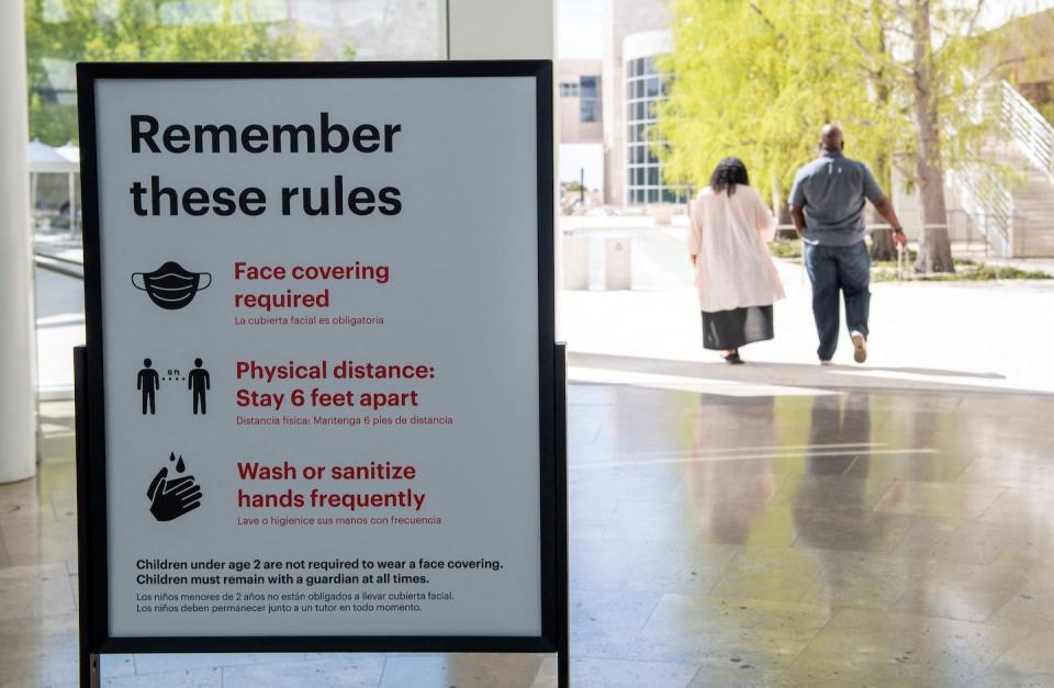 Epidemiologists estimate that three-quarters of all new infectious human diseases originated in animals. <a href="https://www.gettyimages.com/detail/news-photo/sign-listing-the-safety-guidelines-of-the-getty-museum-is-news-photo/1233106978?phrase=covid%20closed%20sign%20california&adppopup=true" rel="nofollow noopener" target="_blank" data-ylk="slk:Valerie Macon/AFP via Getty Images;elm:context_link;itc:0;sec:content-canvas" class="link ">Valerie Macon/AFP via Getty Images</a>