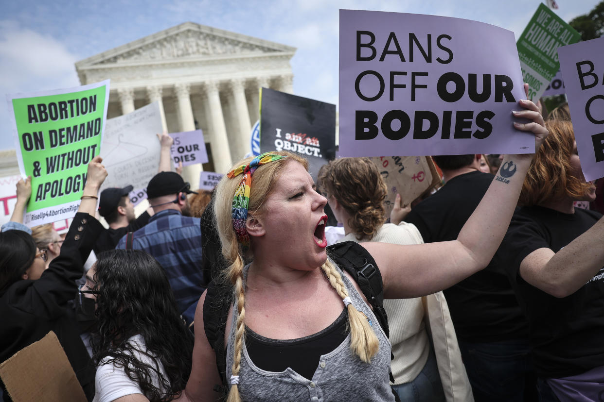 Pro- and anti-abortion rights activists confront one another in front of the Supreme Court in Washington, D.C., on Tuesday. (Win McNamee/Getty Images)