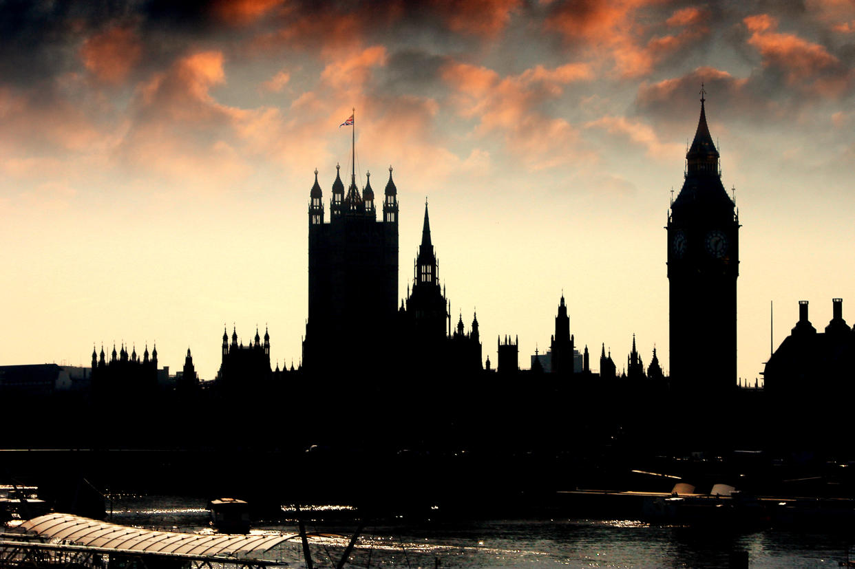 Silhouette of the Houses of Parliament at dusk.